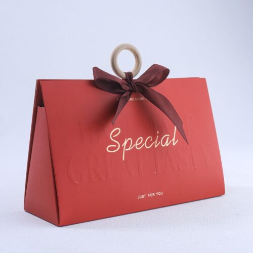 Red triangular wedding candy gift box with wooden handle